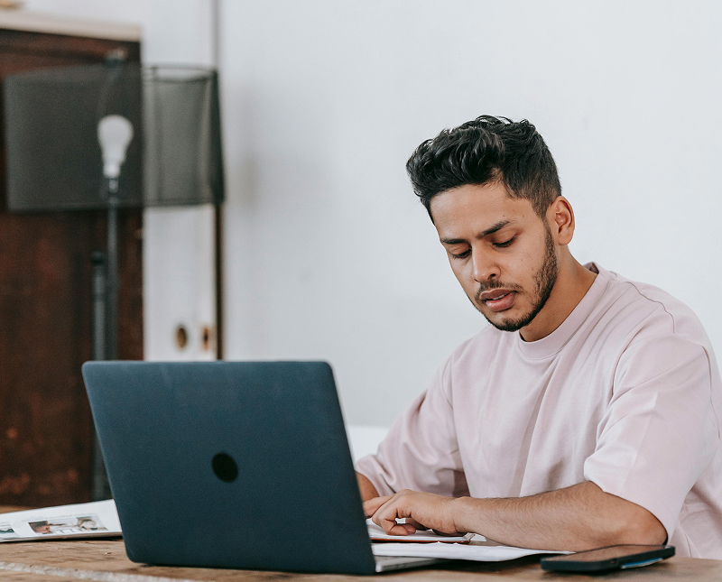 Students looking at a laptop