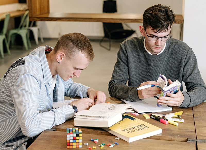 Students looking at a laptop